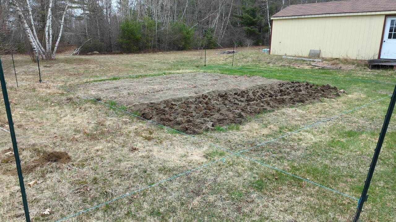 Guide stakes and snap lines installed where the fence will end up