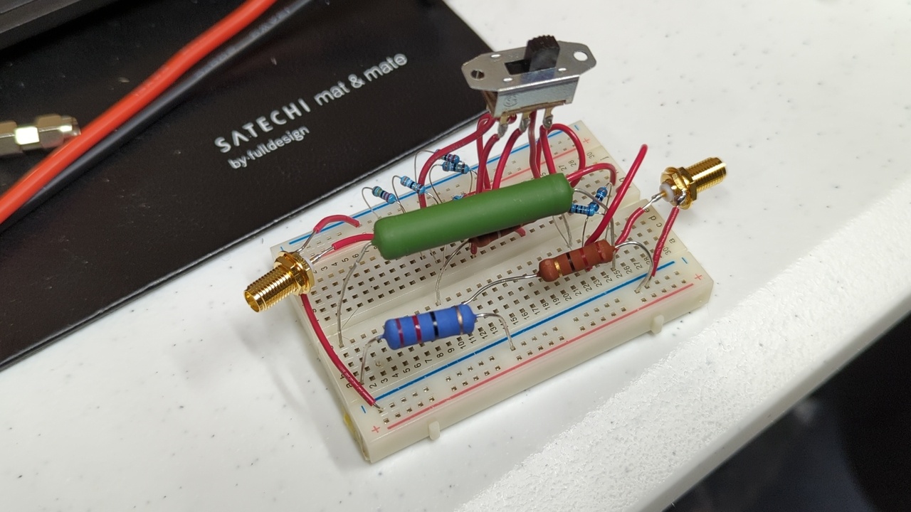 Step attenuator built on a breadboard with some high-power resistors; only one fixed stage and one switchable stage are present