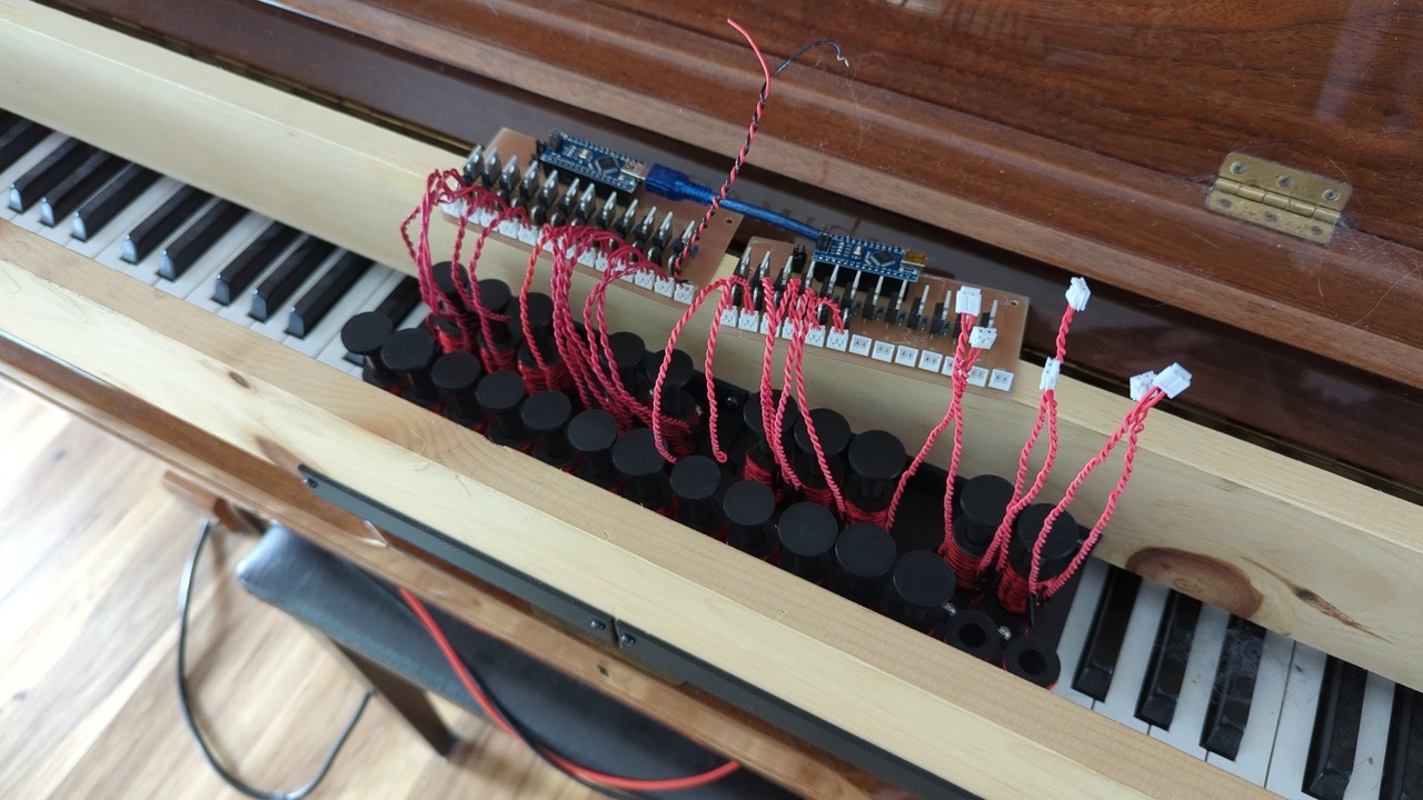 The octave modules viewed from above, revealing the plunger hats and solenoid leads