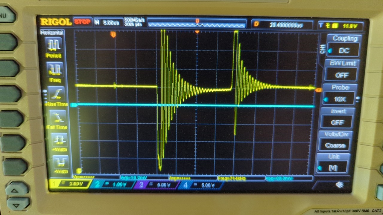 Oscilloscope trace of two large damped oscillations on the supply rail. The first jumps sharply down to about 2.1 V before rebounding to over 18 V off the top of the screen. The second jumps even higher before rebounding to about 7 V. Both oscillations start and end within about 35 microseconds.