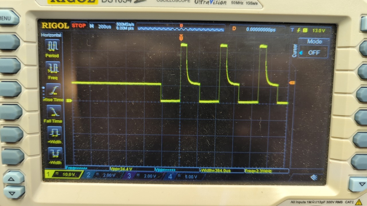 Oscilloscope trace, PWM signal except the rising edges go way above the nominal high part of the signal, get clipped at the top, and then decay down to where they should be, before repeating the cycle